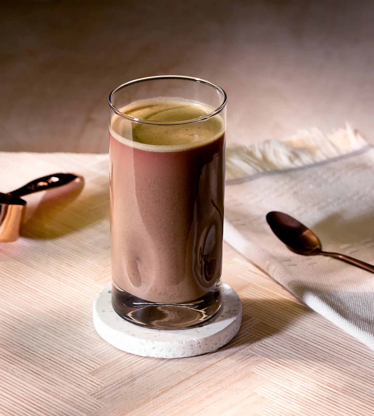 A healthy meal replacement shake in a clear glass.